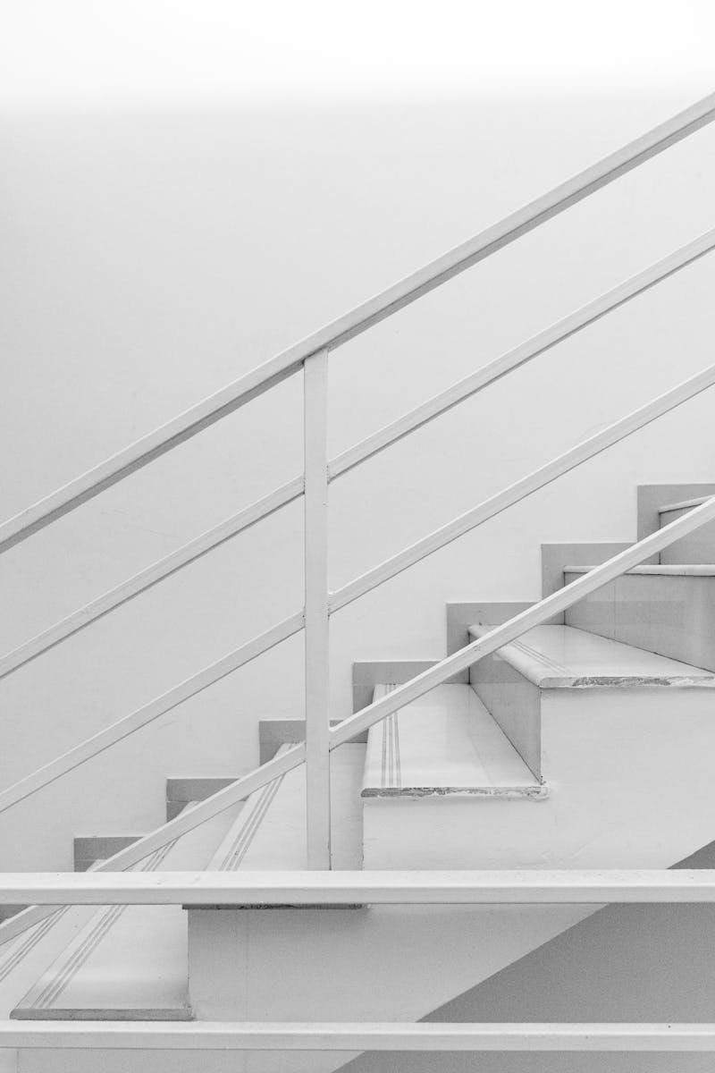 White staircase and railing in modern building